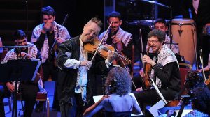 This picture from the Proms website beautifully illustrates  the collaboration between Kennedy and the young musicians from Palestine Strings. BBC/Chris Christodoulou 